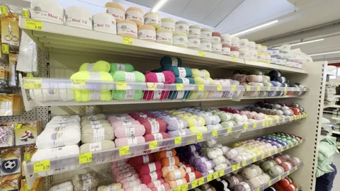 Yarn for knitting at a store aisle, panning shot Stock Footage 332976537