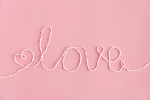 Yarn Love String. Romantic Valentines Day Flatlay on Pink Background Stock Photos