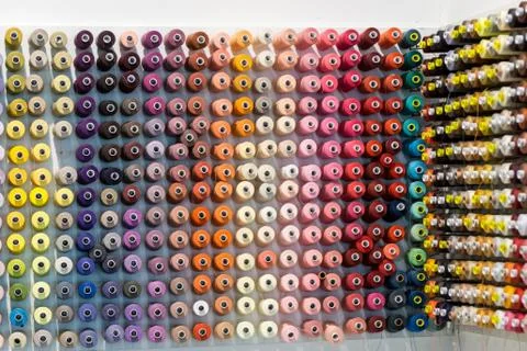 Yarn or thread of different colors on a wall Stock Photos