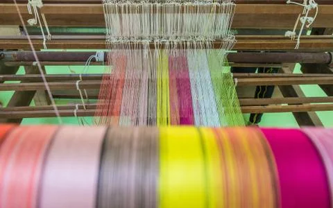 Yarn pattern is set up on the loom bench and ready to weave. Stock Photos