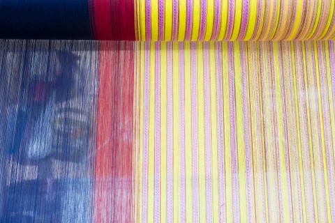 Yarn pattern is set up on the loom bench and ready to weave. Stock Photos