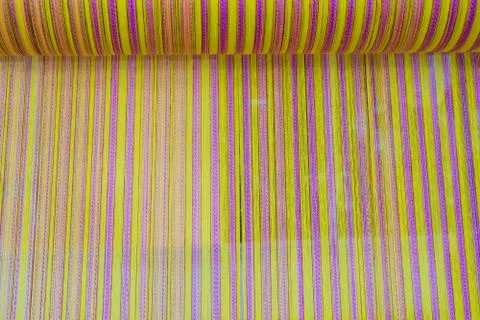 Yarn pattern is set up on the loom bench and ready to weave. Stock Photos