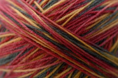 Yarn twisted, in close-up, with yarn, from a macro perspective, with red, y.. Stock Photos