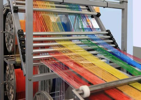 Yarns in the textile machine Stock Photos