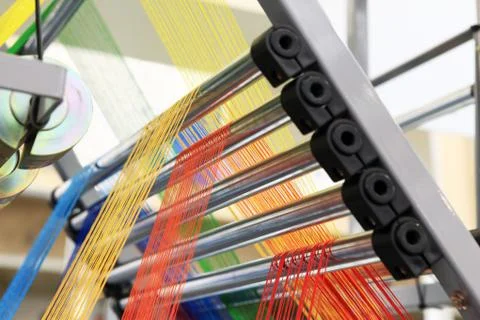Yarns in the textile machine Stock Photos