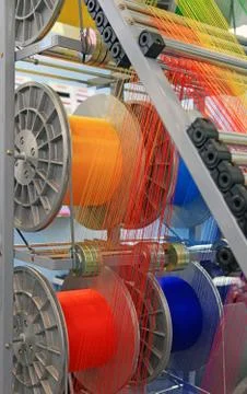 Yarns in the textile machine Stock Photos