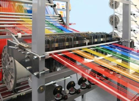 Yarns in the textile machine Stock Photos