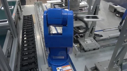 Yaskawa moto mini robot arm on Messe fair in Hannover, Germany Stock Footage 97787976