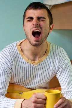 Yawning in bed Stock Photos