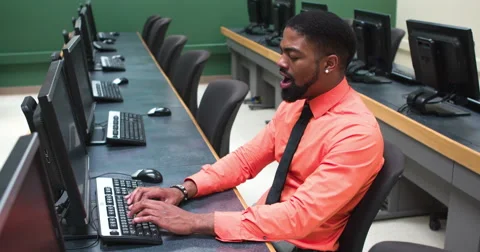 Yawning man working at computer 4k Stock Footage 41777114