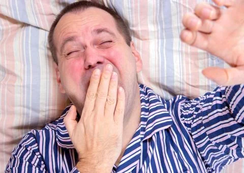 Yawning sleeper Stock Photos