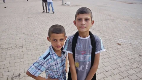 Yazidi refugee kids posing for the camera in a refugee camp Stock Footage 77717767