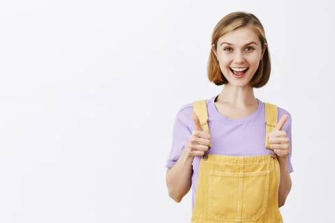 Yeah I support your idea. Attractive young and stylish happy female student in Stock-Fotos