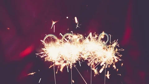 Year 2018 with sparkler and red vintage bokeh Stock Footage 82434671