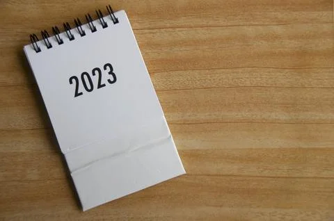 Year 2023 text on white table calendar with customizable space for text or .. Stock Photos
