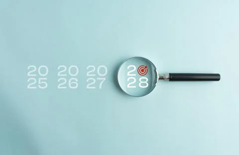 Year 2028 highlighted through a magnifying glass among previous years, repr.. Stock Photos