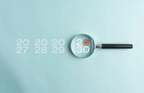 Year 2030 highlighted through a magnifying glass among previous years, repr.. Stock Photos