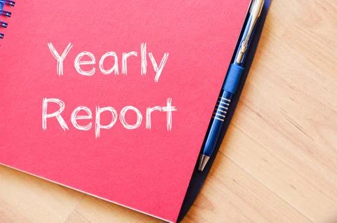 Yearly report write on notebook Stock Photos