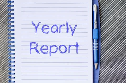 Yearly report write on notebook Stock Photos
