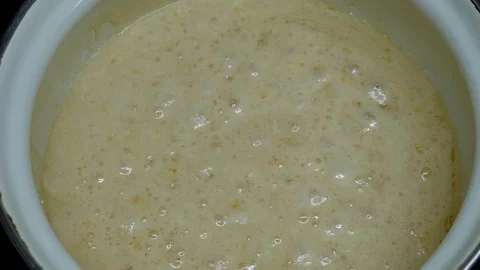 Yeast boiling in a pot Stock Footage 127699660