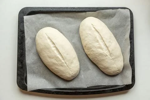 Yeast buns on a baking sheet Foto stock