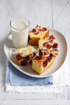 Yeast Cake With Plums Served With A Glass Of Soya Milk