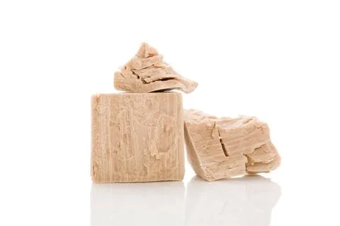 Yeast cubes for bread making isolated on white background. Yeast blocks is... Foto stock