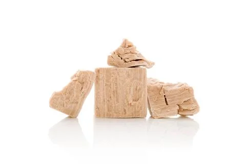 Yeast cubes for bread making isolated on white background. Fresh pressed y... Foto stock