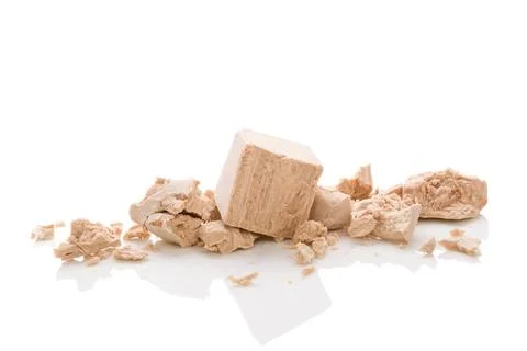 Yeast cubes for bread making isolated on white background. Yeast blocks is... Foto stock