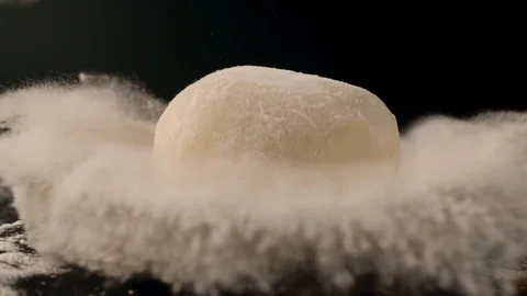 Yeast dough with flour on the kitchen table, cooking food in dark key, cooking 動画素材 116339427