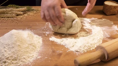 Yeast dough rolled on a rolling pin Stock Footage 77494004