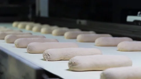 Yeast Rolls Falling Into Container Stock Footage 90122727