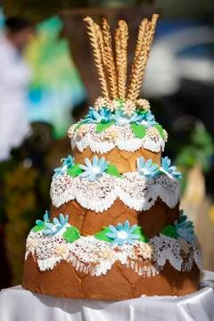 Yeast three-layer Russian loaf decorated with flowers. Beautiful pastries. Stock Photos