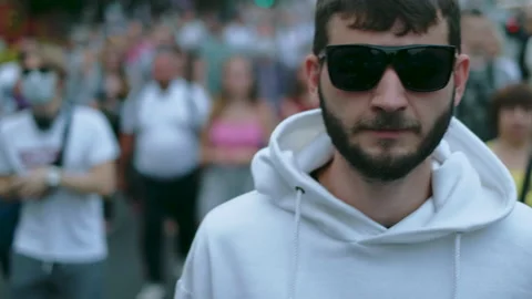 Yelling, shouting rebel protester guy in marching crowd of opposition resistance Stock Footage 160982528