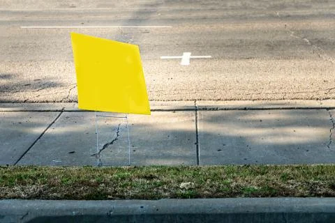 Yelliow empty placard, poster besides a road, copy space Stock Photos