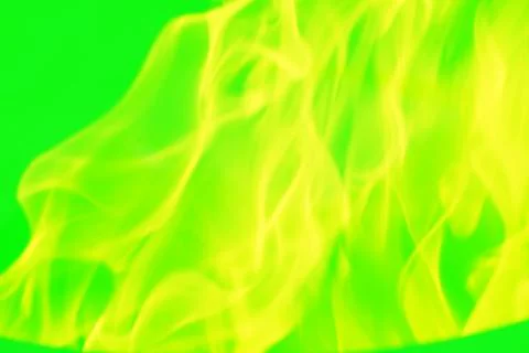 Yellow abstract pattern, glare of light, flames, smoke on a green background. Stock Photos