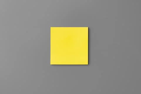Yellow adhesive notes on gray background close up Stock Photos