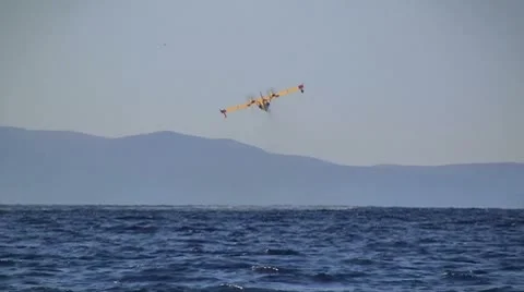 Yellow airplane flying Stock Footage 8944875