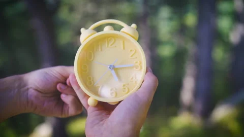 Yellow alarm clock daylight saving time end Stock Footage 161722905