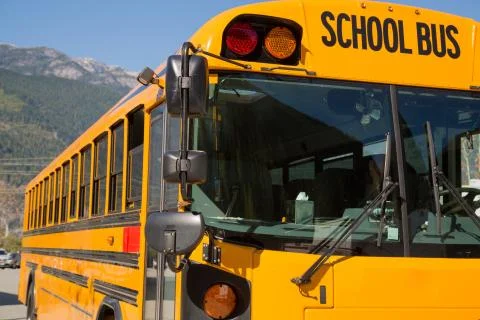 Yellow american schoolbus background closeup Foto stock