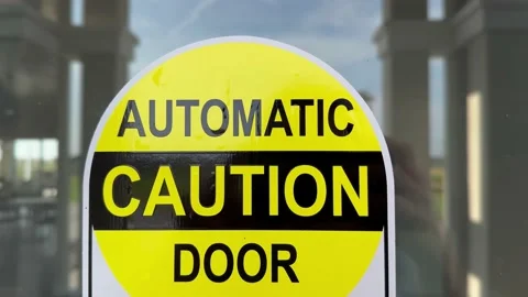 Yellow and Black Automatic Caution Door Sign Stock Footage 235667635