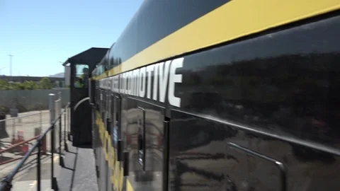 Yellow and black engine heading out, from the side of the engine Stock Footage 123390251