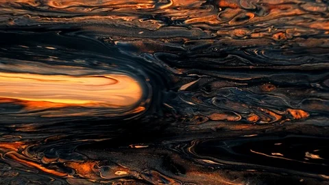 Yellow and black psychedelic patterns of multi-colored paints mixed with each Stock Footage 123744154