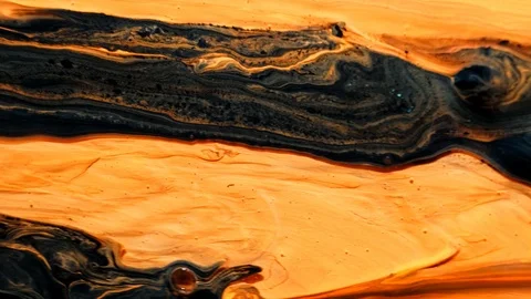 Yellow and black psychedelic patterns of multi-colored paints mixed with each Stock Footage 123745066