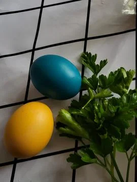 Yellow and blue Easter egg on the table Stock Photos