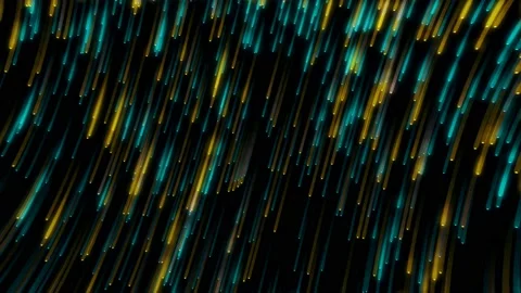 Yellow and blue glittering particles fall from corner to corner against a black Stock Footage