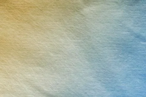 Yellow and blue gradient on background of soft fabric texture 스톡 사진
