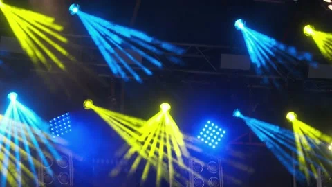 Yellow and Blue rays of Light. Lighting Equipment on a stage decoration on a con Video stock 136052521