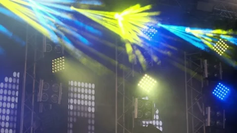 Yellow and Blue rays of Light. Lighting Equipment on a stage decoration on a con Video stock 136077236