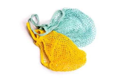 Yellow and blue string mesh reusable bags isolated on white Stock Photos